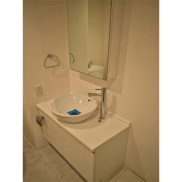 ホテルライクな洗面台。丸くて可愛らしいです。