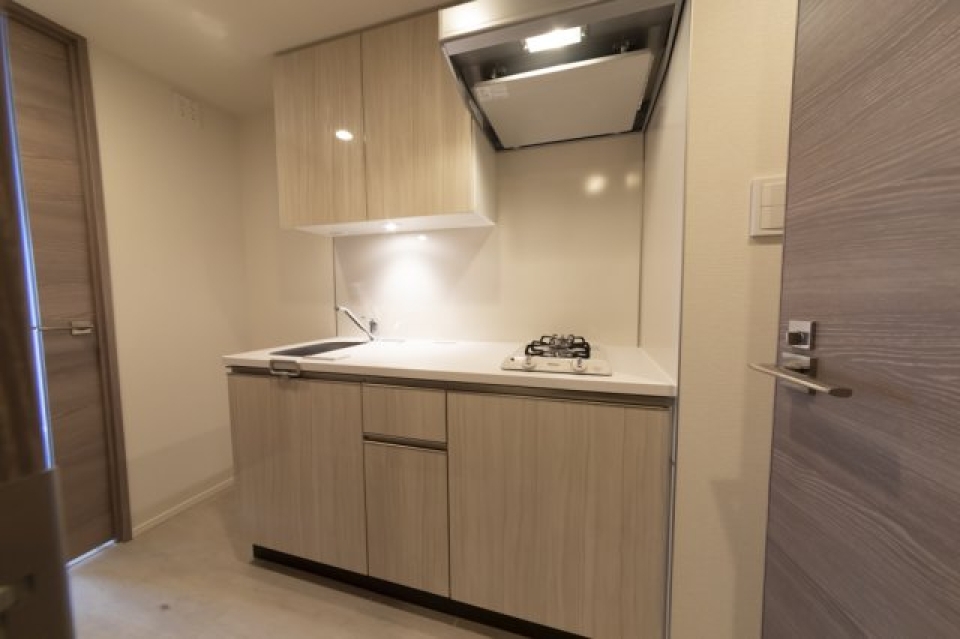 ナチュラルなパネルが導入されたキッチンです。