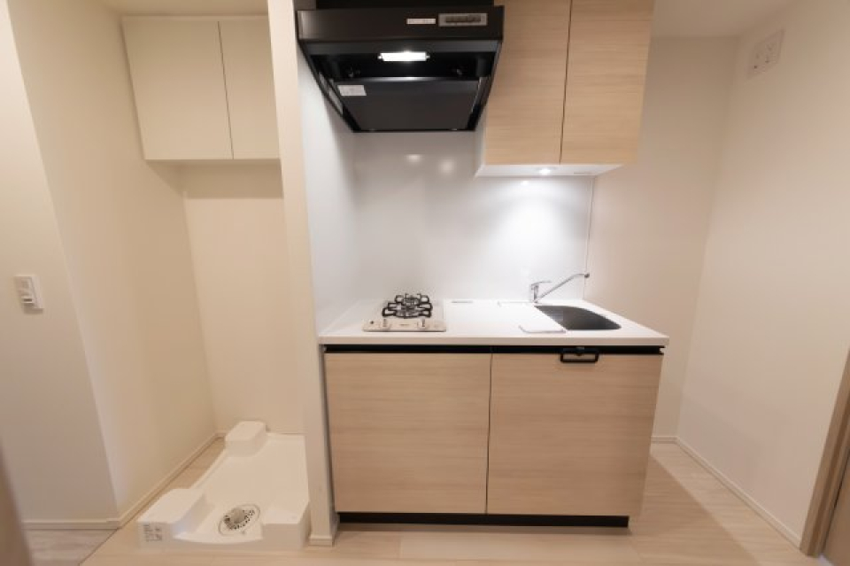 ナチュラルなパネルが導入されたキッチンです。