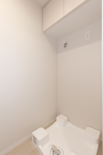 洗濯機置き場も同じ空間に。※写真は同タイプ住戸です。